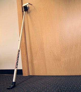 A door bar in use on a school door