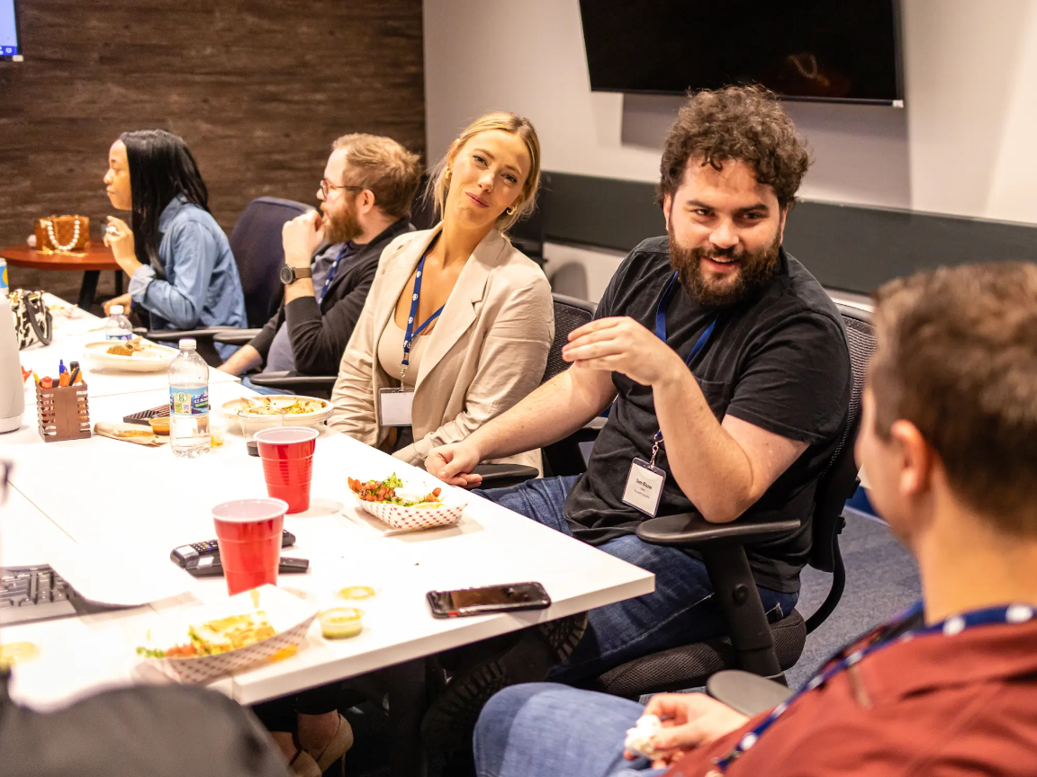 FMX teammates socializing at an in-office happy hour