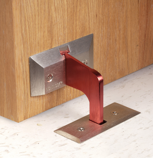 Floor barricade in use on a school door