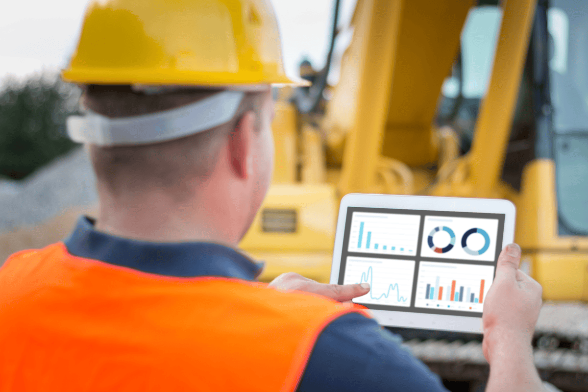 man at construction site with tablet capital planning